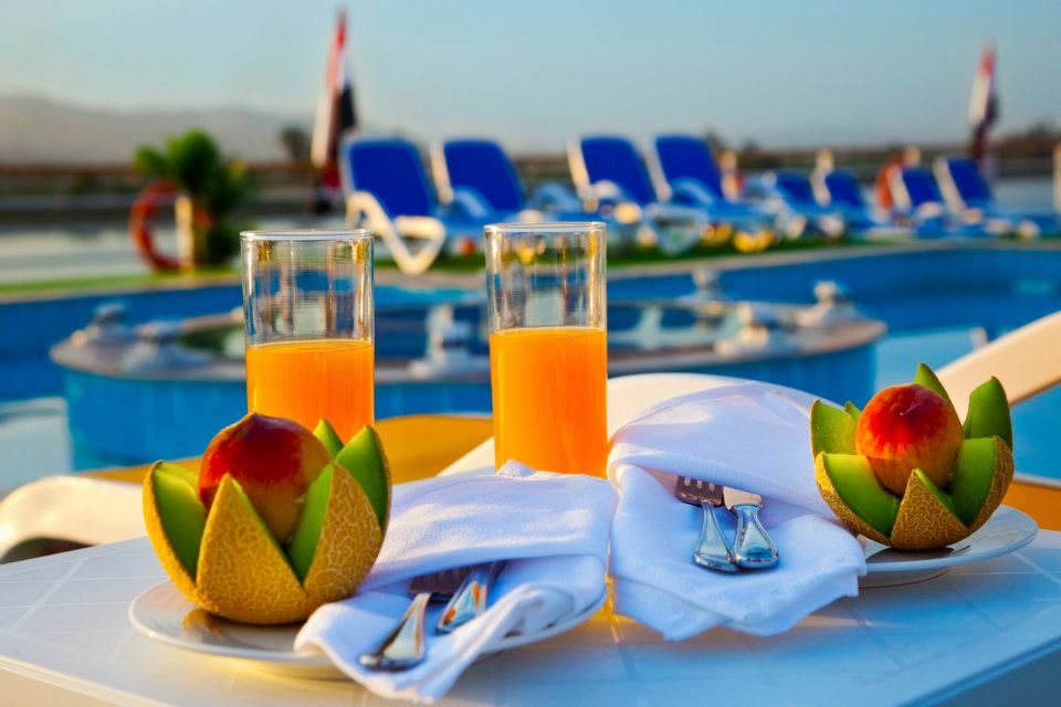 Fruit and juice on the actual cruise sun deck beside blue loungers